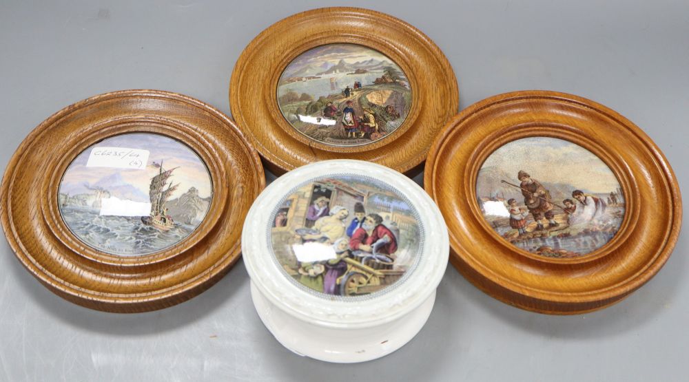 Three Prattware pot lids in oak frames and another Prattware pot